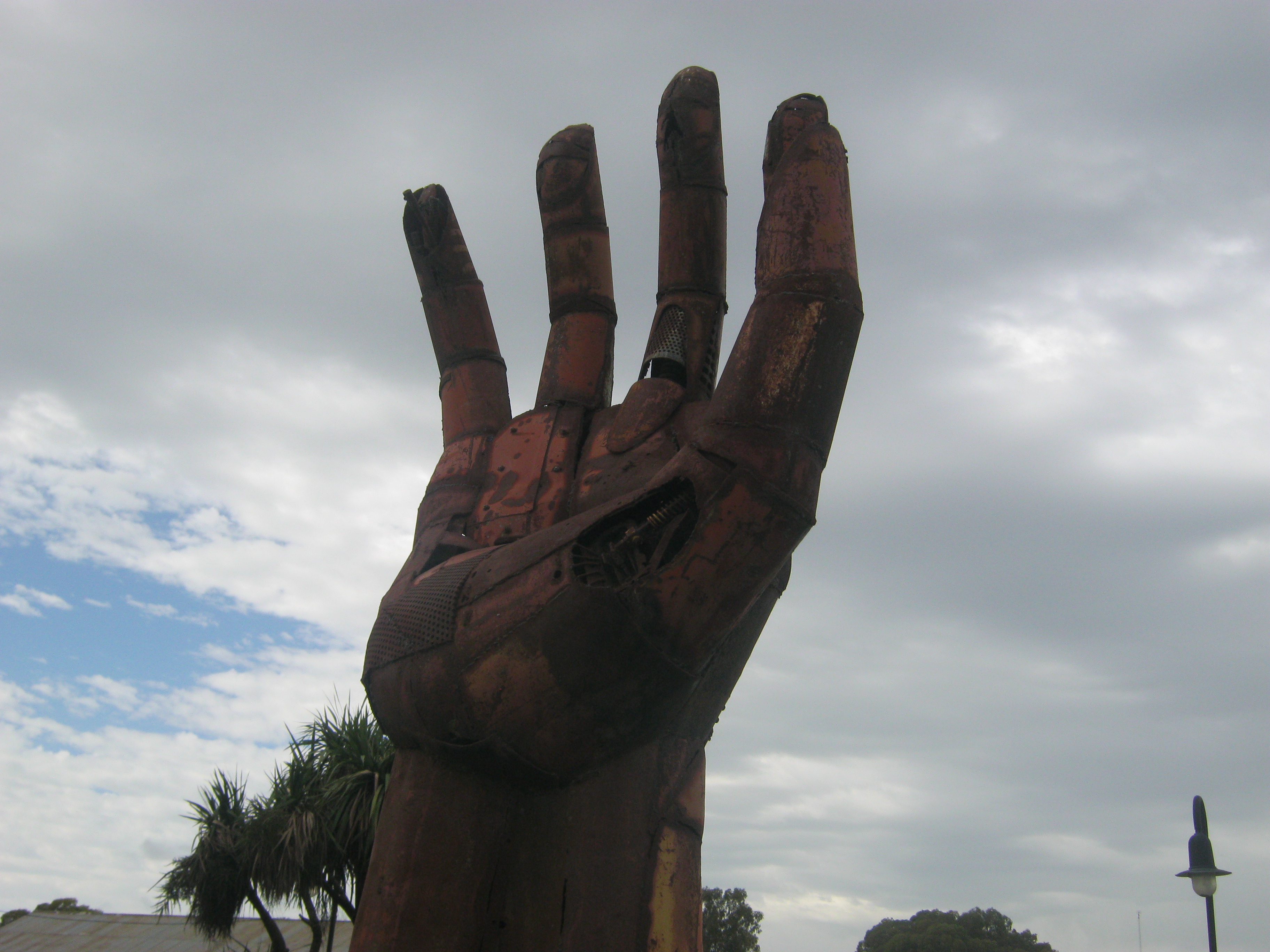 A giant hand made of rusted metal