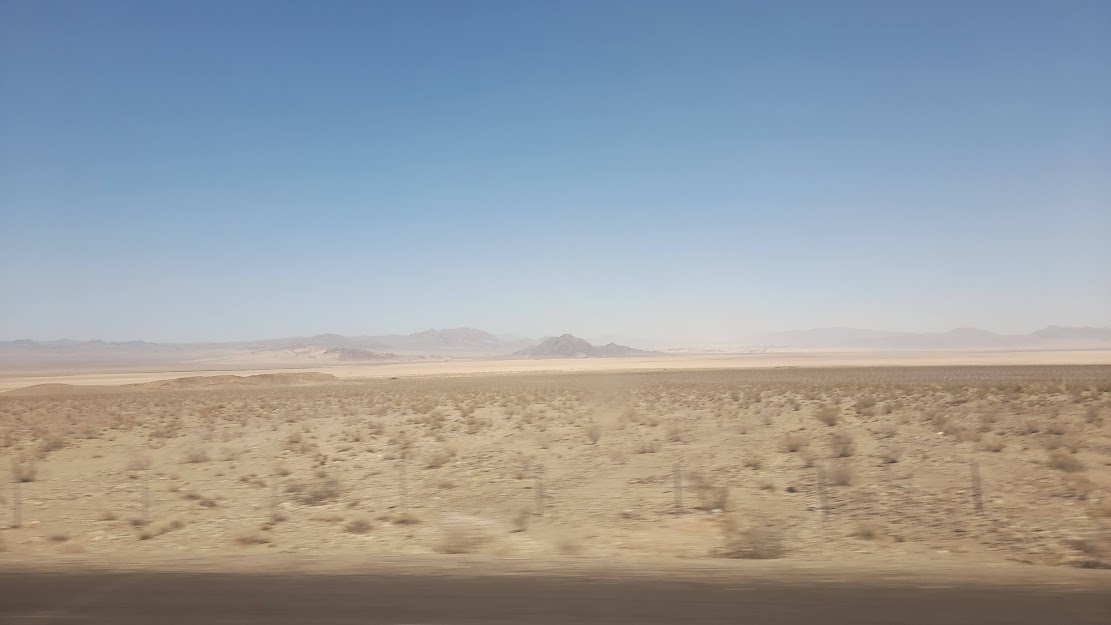 a desert under a blue sky